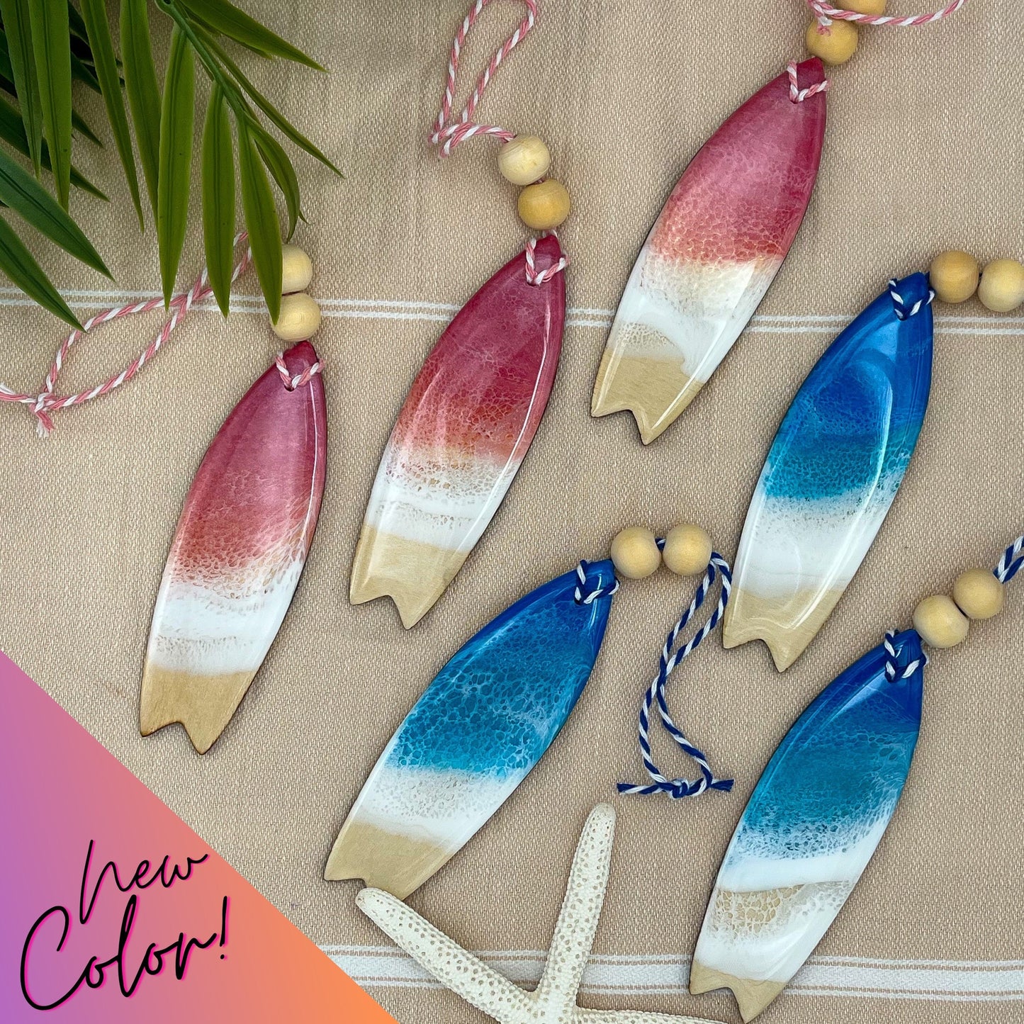 Surfboard shaped wooden christmas ornament covered in ocean resin art resembling the waves of the sea. Available in two colors - Ocean Blue and Pink Sunrise.  Finished with baker&#39;s twine and two wooden beads.