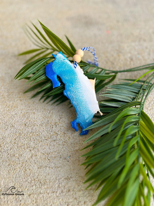 Handmade Costa Rica shaped wooden ornament featuring ocean resin waves, finished with blue and white twine and two natural wooden beads