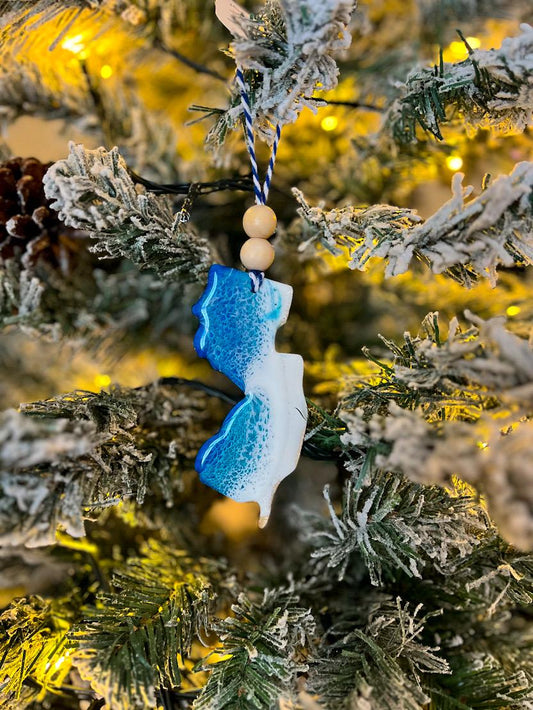 Handmade New Jersey shaped wooden ornament featuring ocean resin waves, finished with blue and white twine and two natural wooden beads