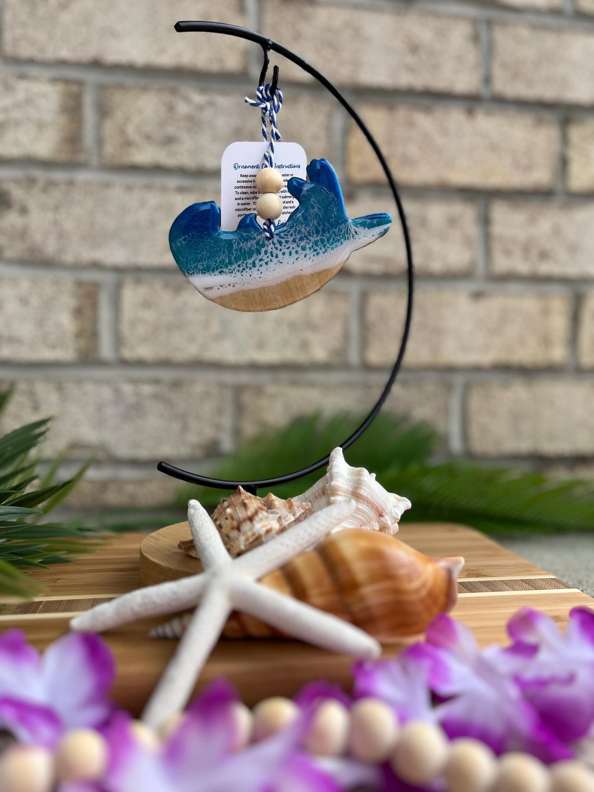 Sea Otter Ornament hanging on an ornament hook.