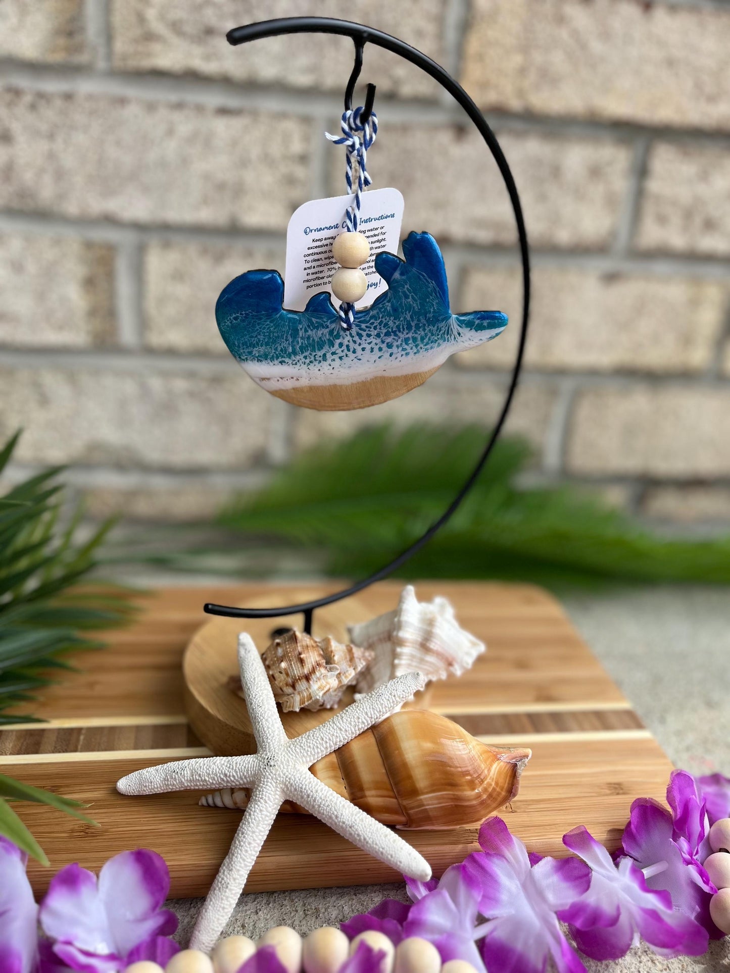 Sea Otter Ornament hanging on an ornament hook.