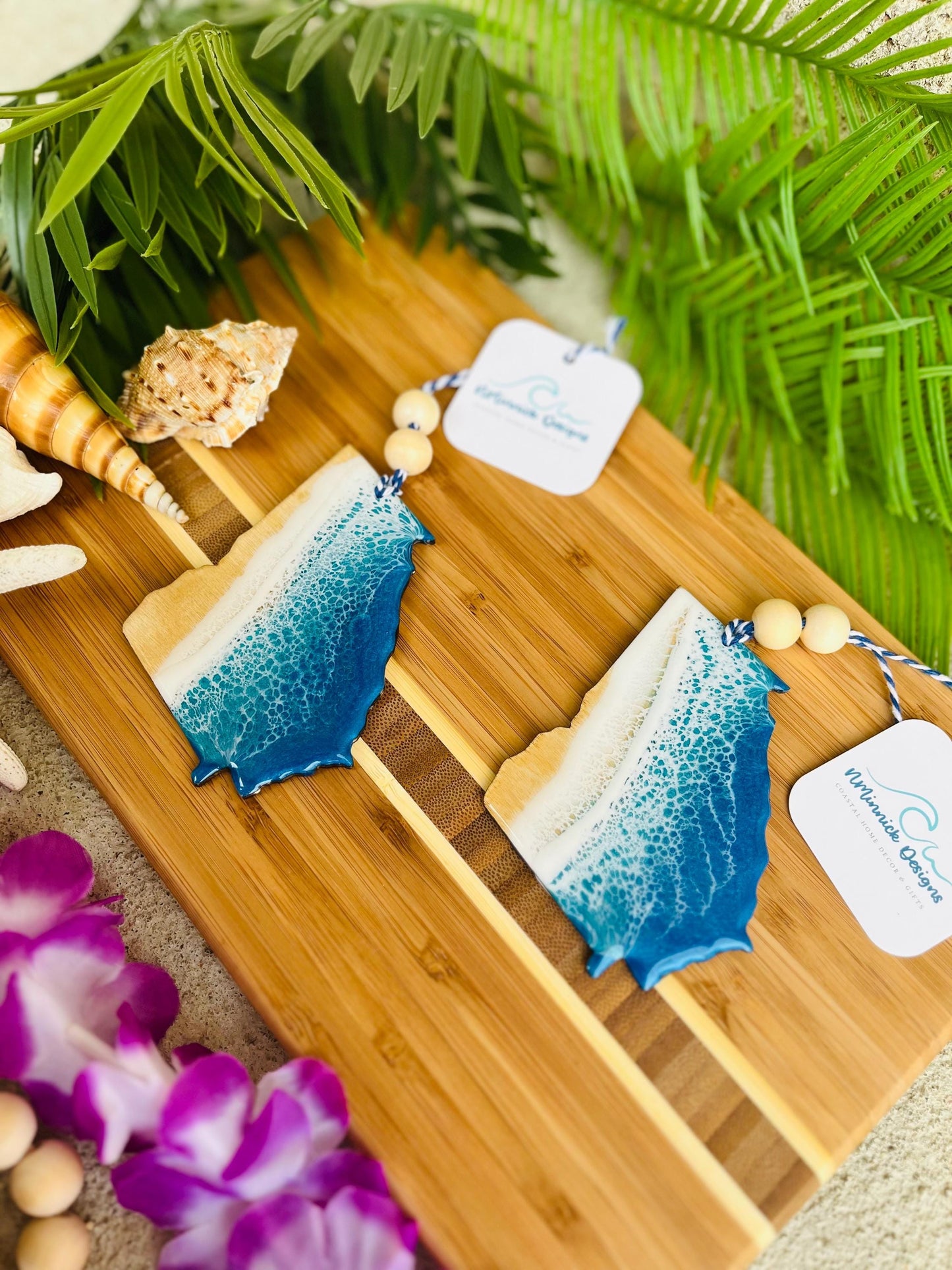 Georgia Beach Ornaments laying on a bamboo cutting board