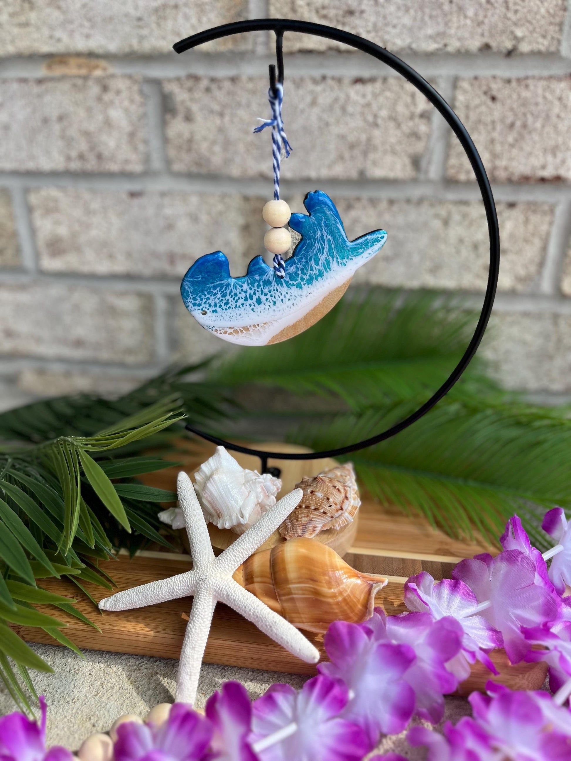 Sea Otter Ornament hanging on an ornament hook.