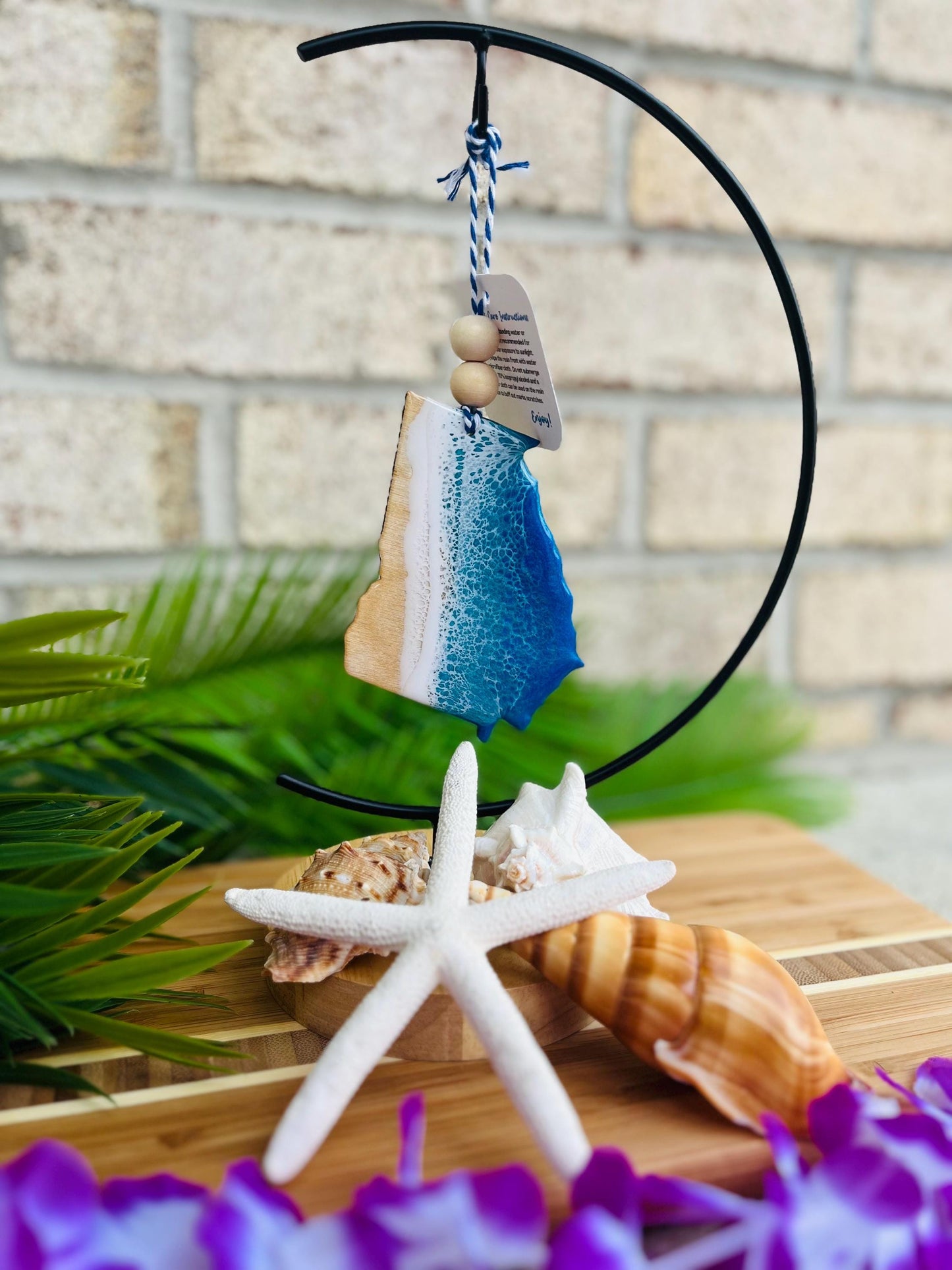 Georgia Beach Ocean Resin Ornament hanging on an ornament hanger.