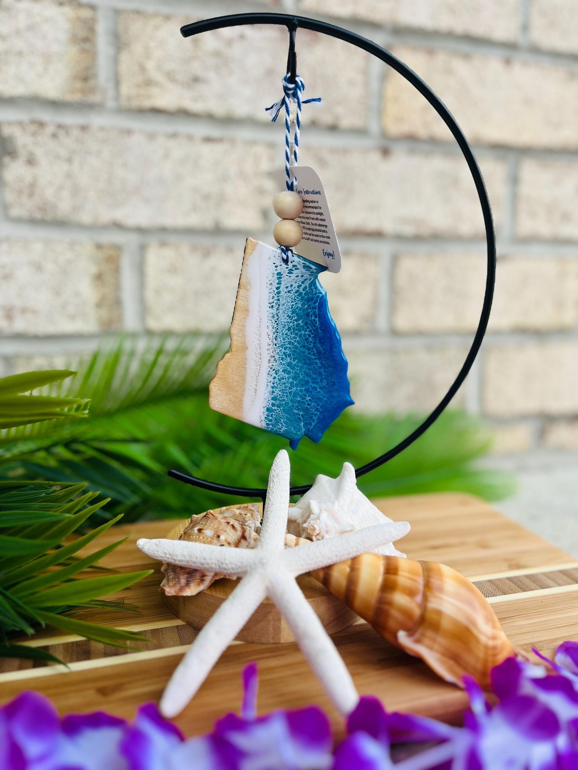 Georgia Beach Ocean Resin Ornament hanging on an ornament hanger.