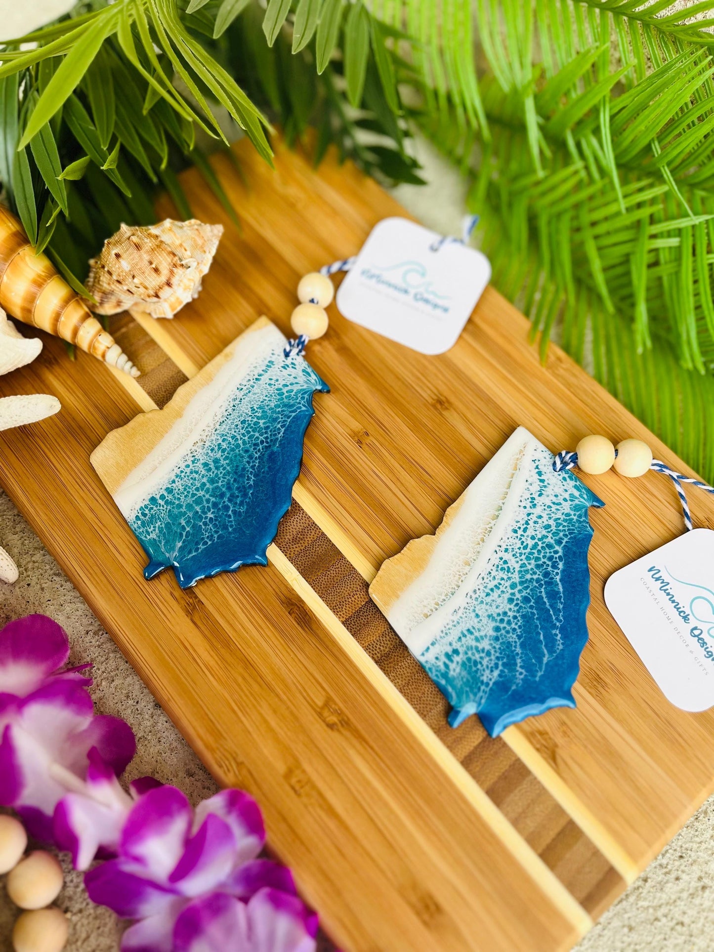Georgia Beach Ornaments laying on a bamboo cutting board
